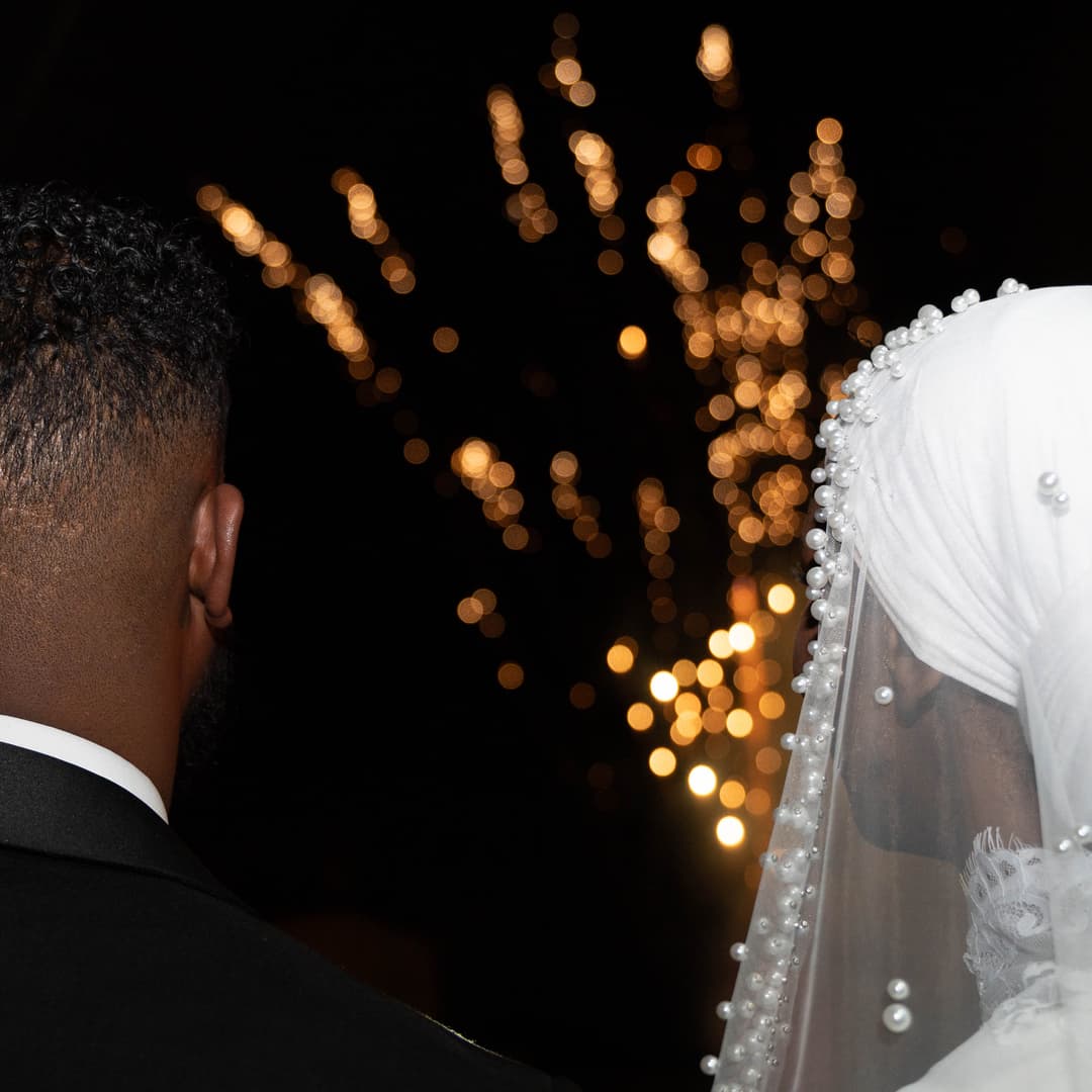 bride and groom enjoying the fireworks show